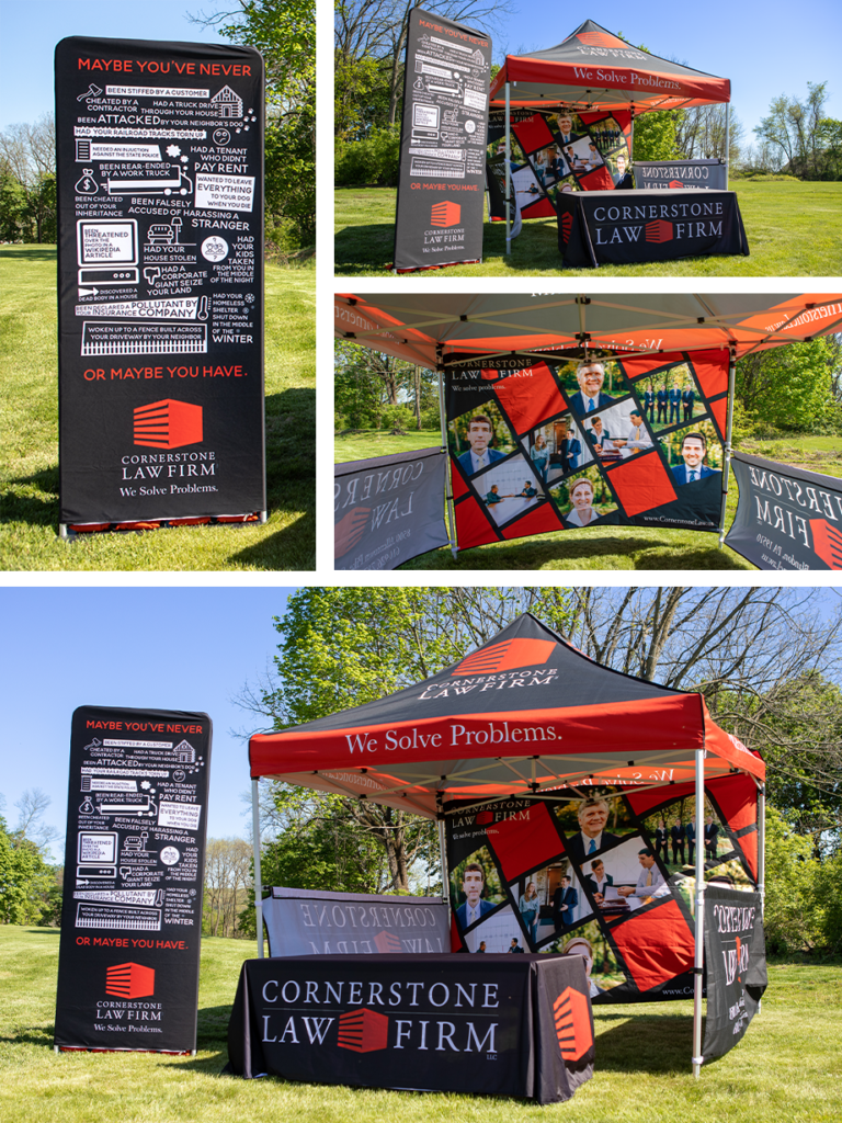 Example photos of a tent, banner, and tablecloth design for Cornerstone Law Firm