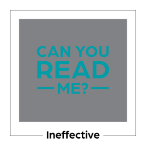 An example of ineffective color contrast. It's a medium gray square with the words "Can you read me?" written in a blue that does not contrast enough with the gray.