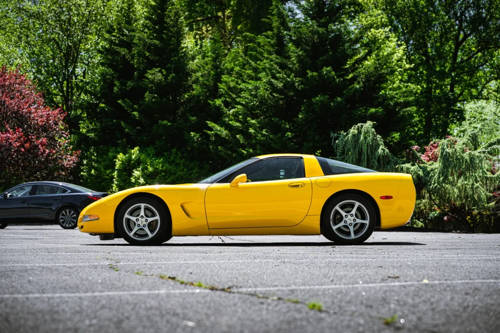 A photo of a yellow Corvette from the side