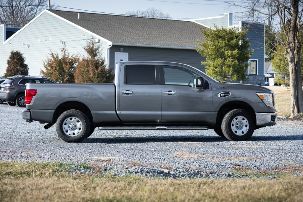 A photo of a gray truck from the side