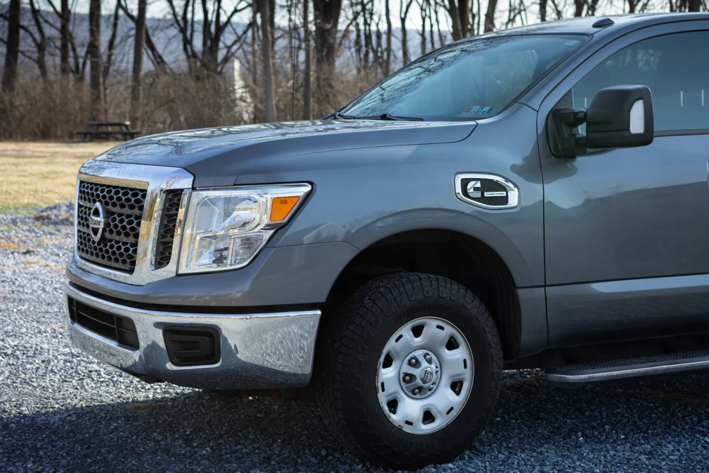 A photo of a gray truck from the front