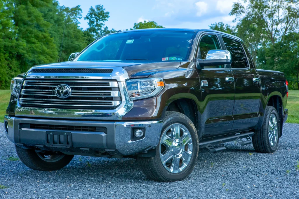A photo of a brown truck from the front