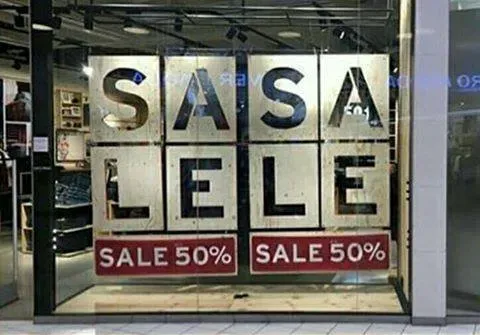 Two 50% sale signs next to each other that look like they say "SASA LELE Sale 50% Sale 50%"